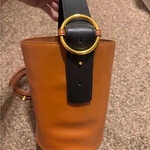 Chic Tan and Black Bucket Bag with Gold Accents